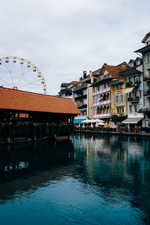 Ferris Wheel and Waterfront Buildings in Thun Old Town, Switzerland
