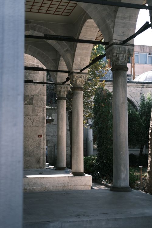 Free View of historic stone columns in a traditional İstanbul courtyard, Türkiye. Stock Photo