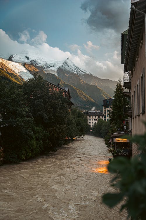 Swollen Muddy River Flowing Through French Town Chamonix at the Foot of the Alps