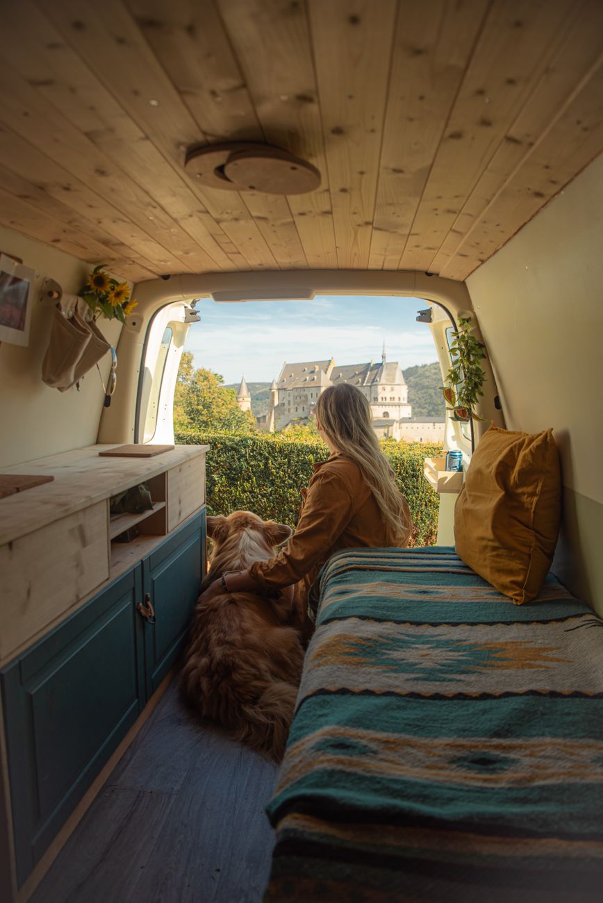 Woman and dog in campervan