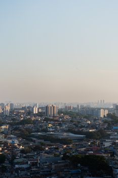 A stunning cityscape showcasing a bustling urban skyline with a mix of high-rise buildings and residential areas at dawn.