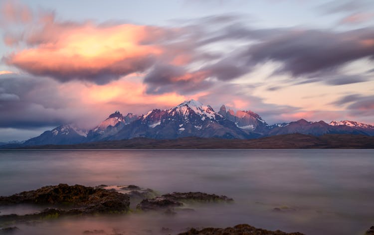 Clouds Over Mountains At Sunset