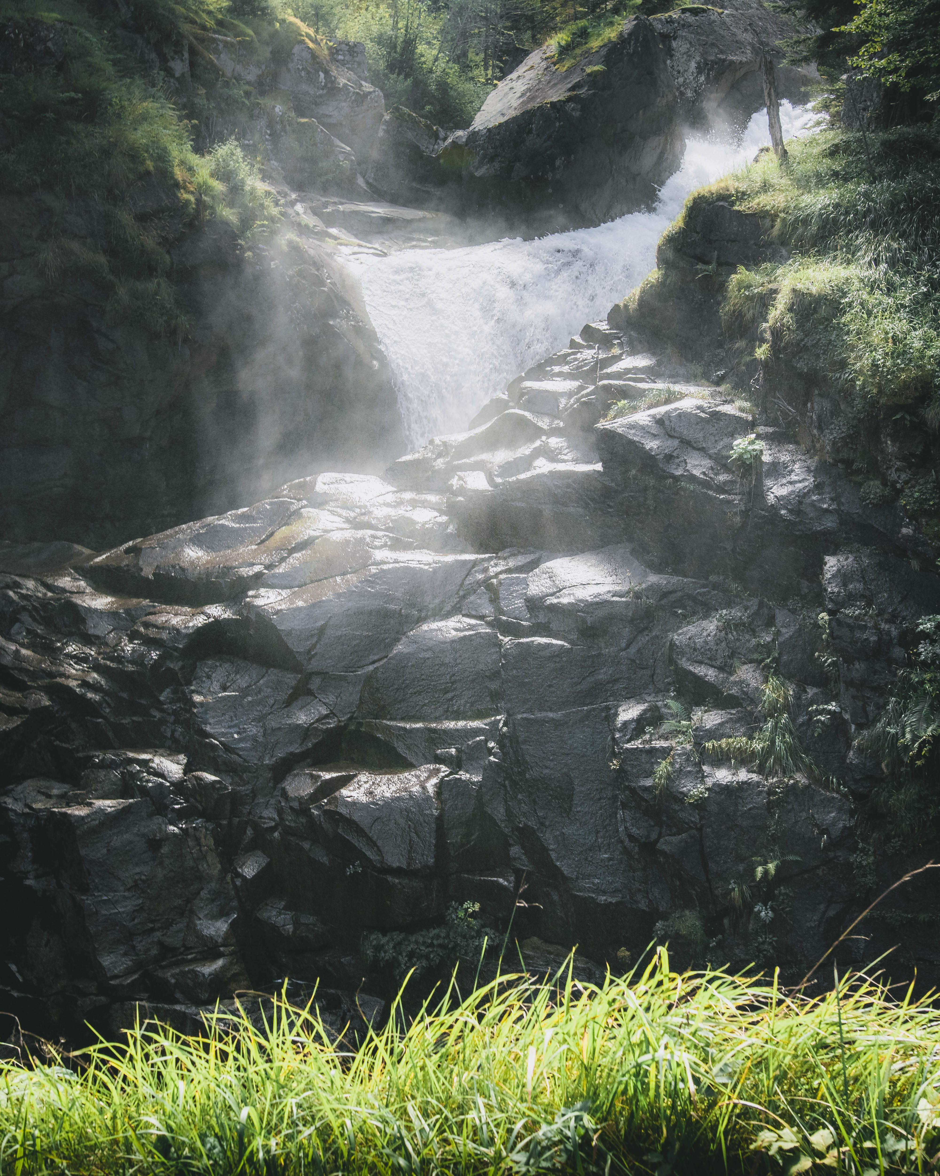 Rocks and Waterfall behind · Free Stock Photo