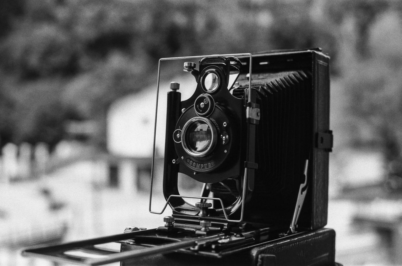 close up of a vintage camera in black and white showcasing its intrica