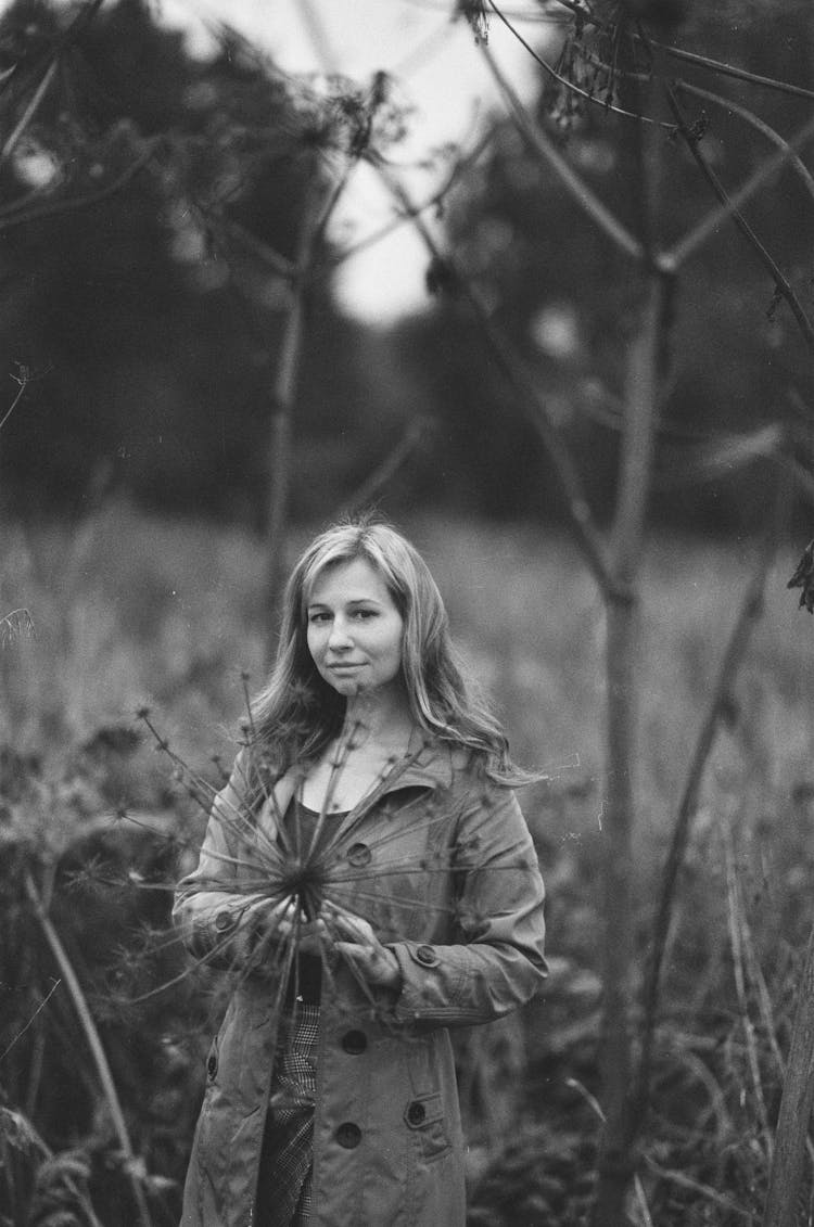 Smiling Woman Standing In Nature