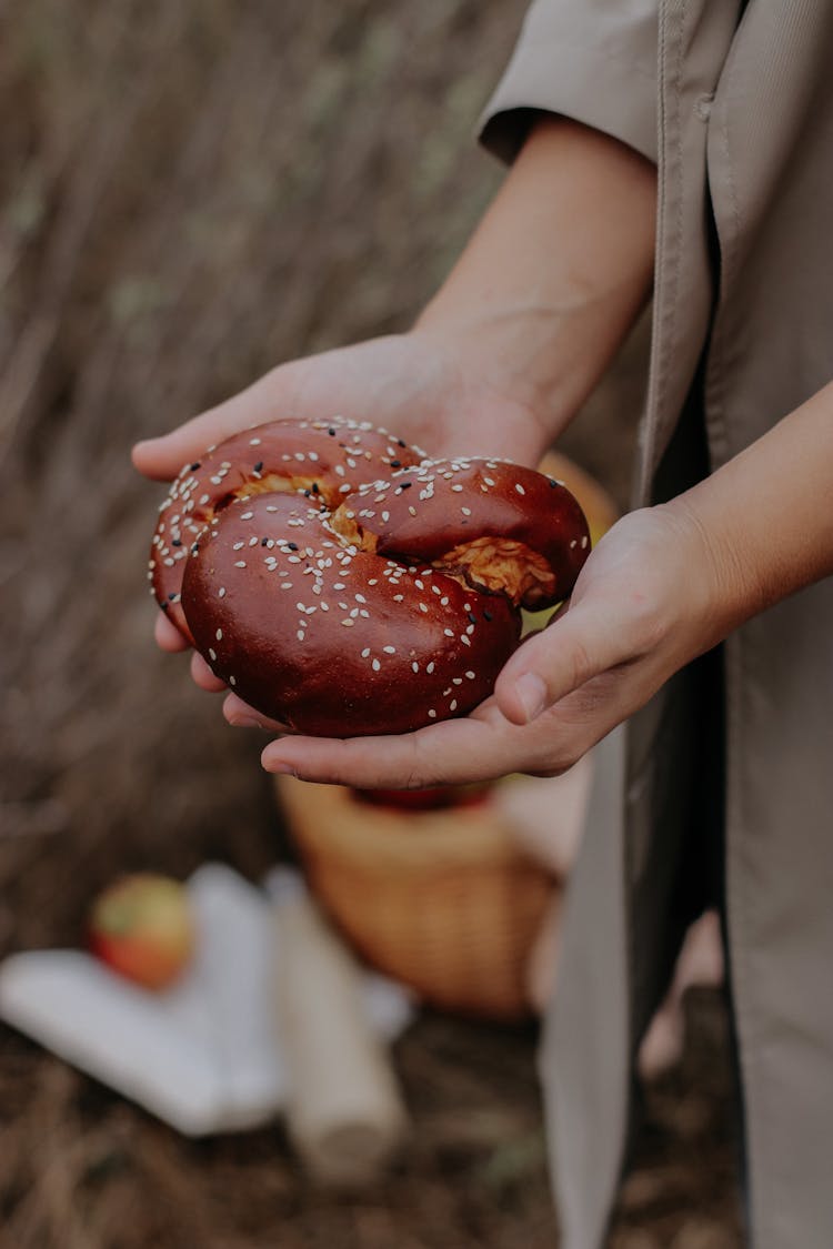 Person Holding A Bun