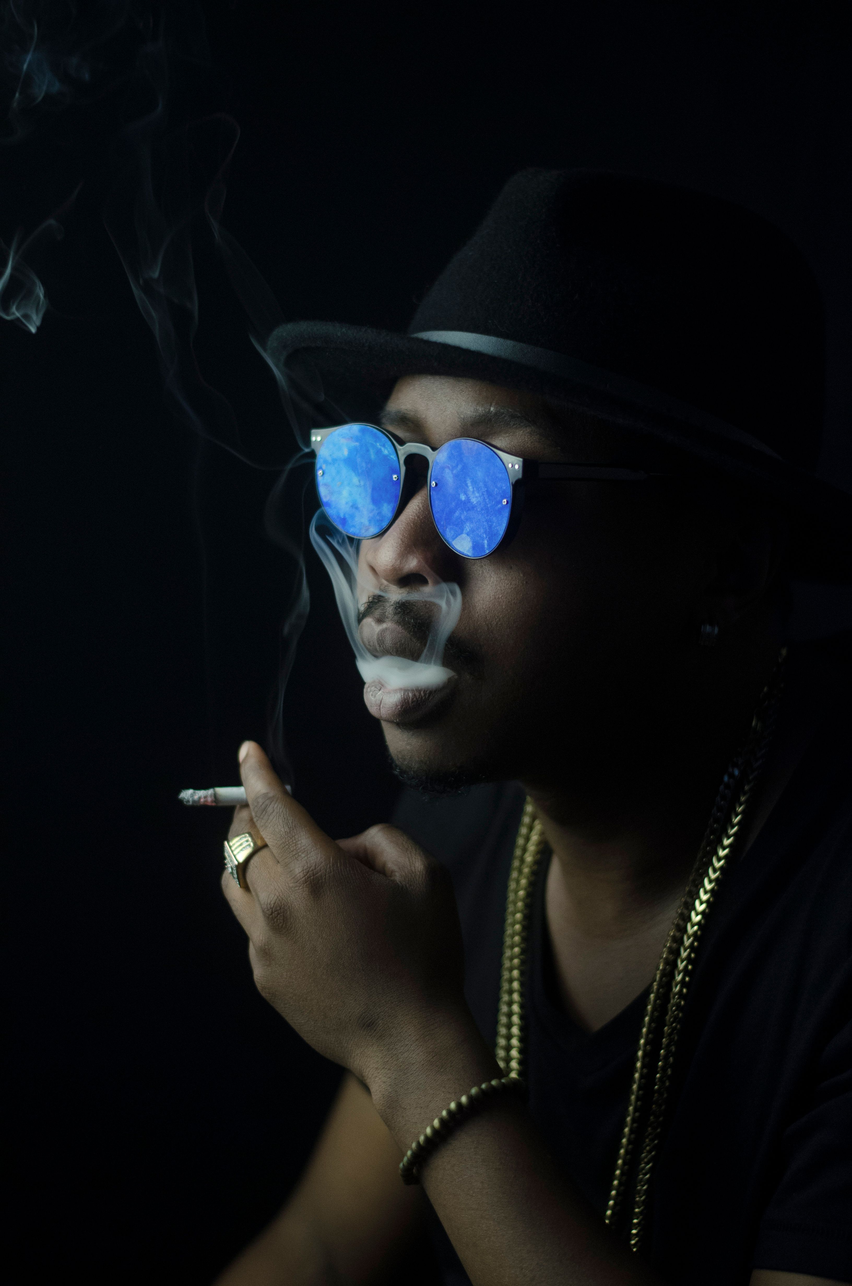 cool guy with cigarette Photo of Man Smoking Cigarette · Free Stock Photo