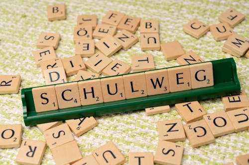 A wooden board with the word schwule written on it