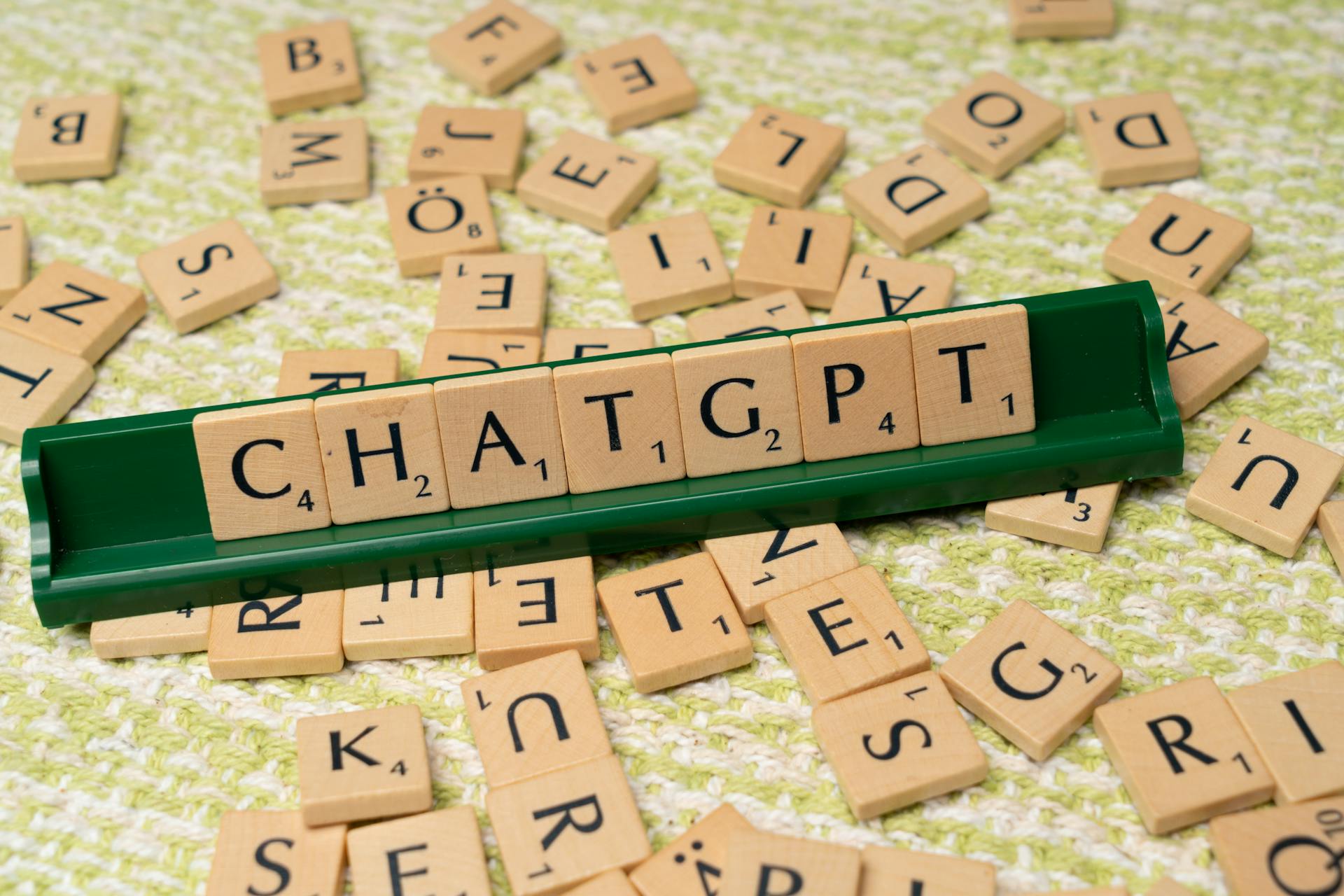 The word chatgpt is spelled out in scrabble tiles