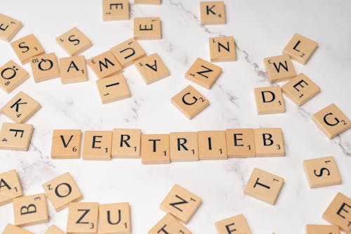 Scrabble tiles with the word verrittt written on them