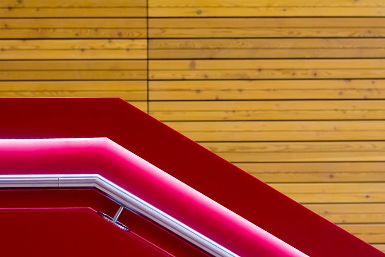 A Red Construction Against A Wooden Wall