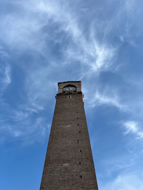 Free A towering Ottoman clock tower stands tall under the blue sky in Adana, Turkey. Stock Photo