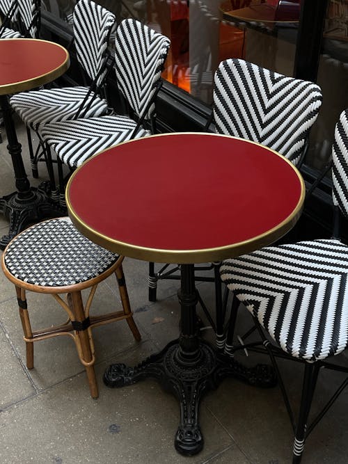 Red Table and Chairs on Pavement