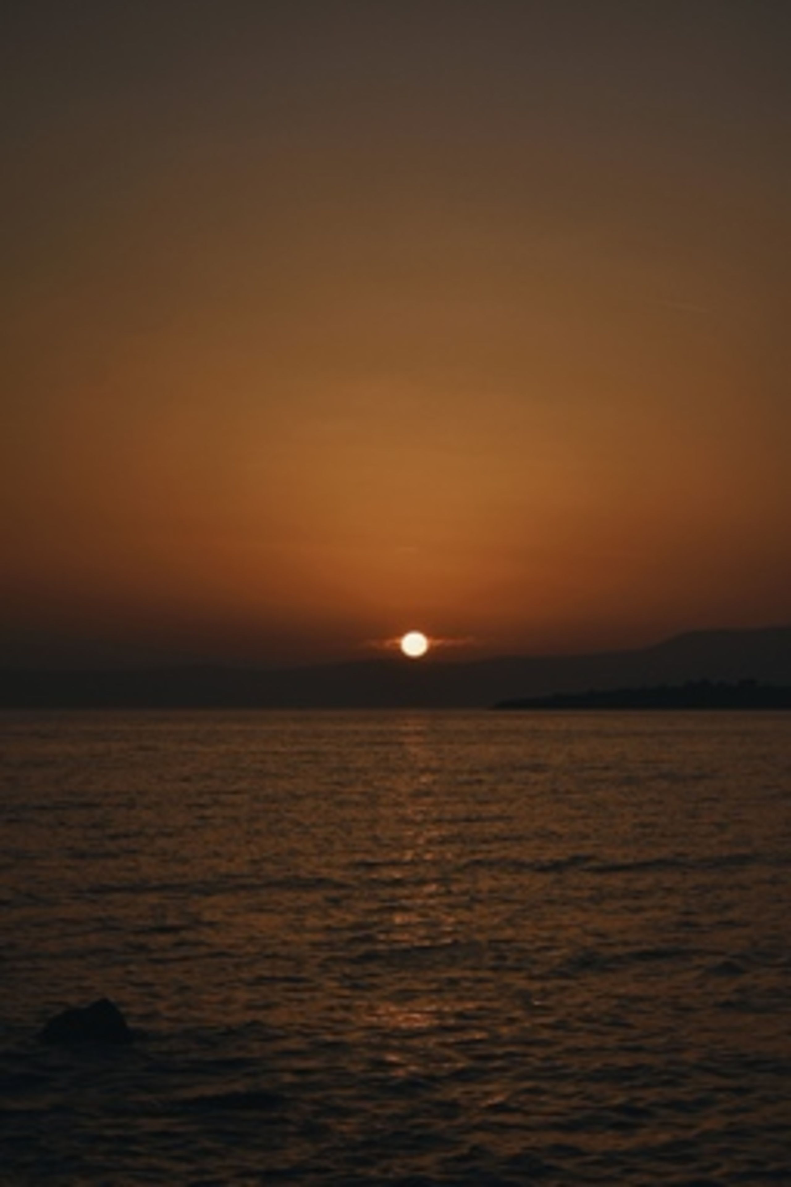 Yellow Sky at Sunset over Sea Coast · Free Stock Photo