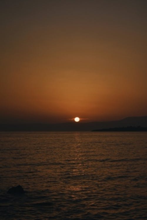 Yellow Sky at Sunset over Sea Coast