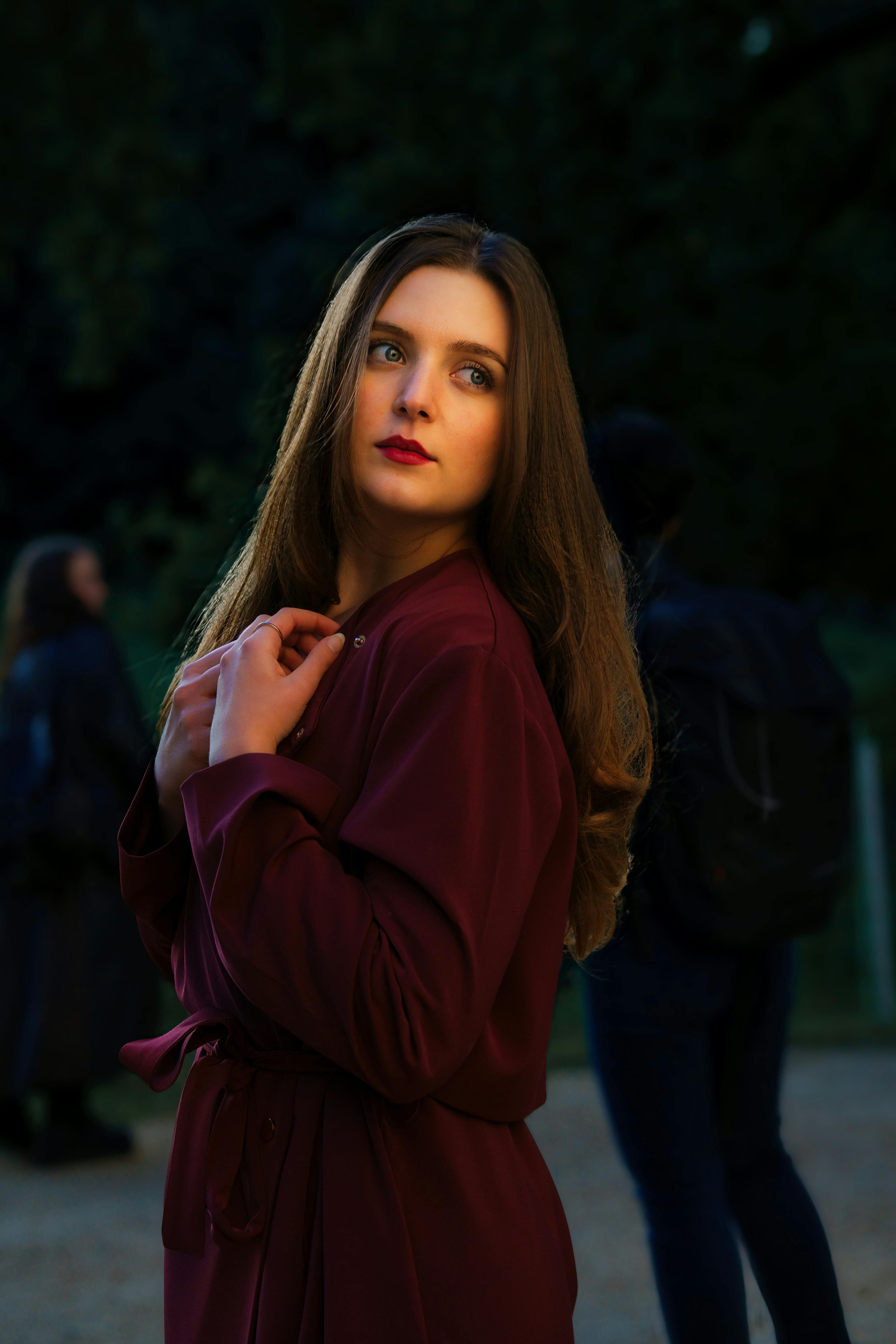 full length portrait of a pretty brunette girl wearing a red shirt