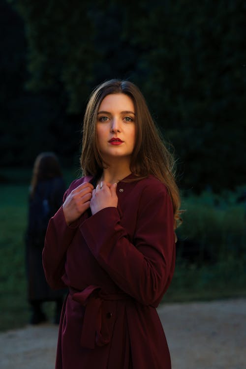 Portrait of a Female Model Wearing a Red Overcoat