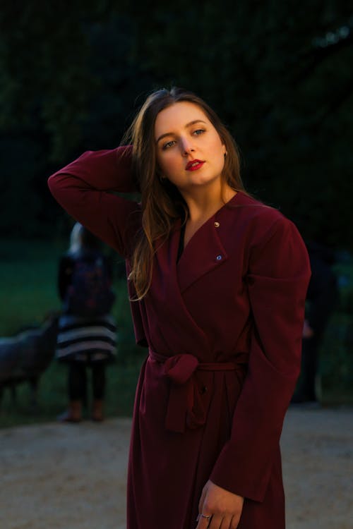 Female Model Wearing a Red Overcoat