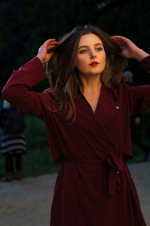 Portrait of a Pretty Brunette Wearing a Red Overcoat