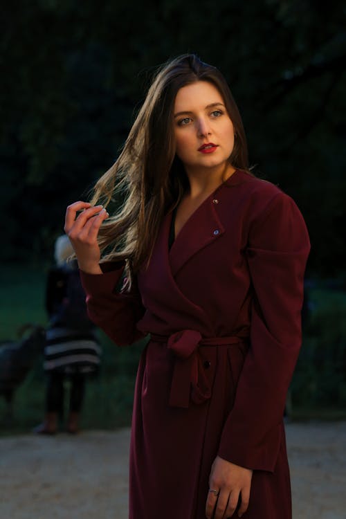 Young Woman Wearing a Red Overcoat