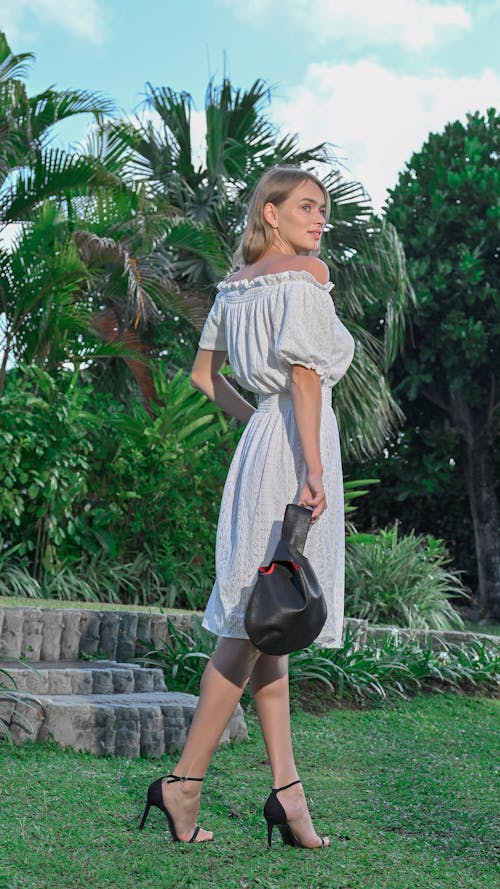 Blonde Woman in Sundress and with Bag