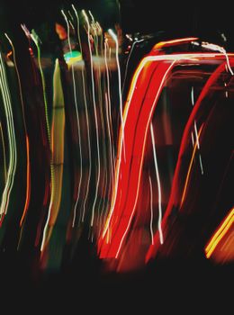 Dynamic abstract composition of vibrant light trails captured at night using long exposure techniques.