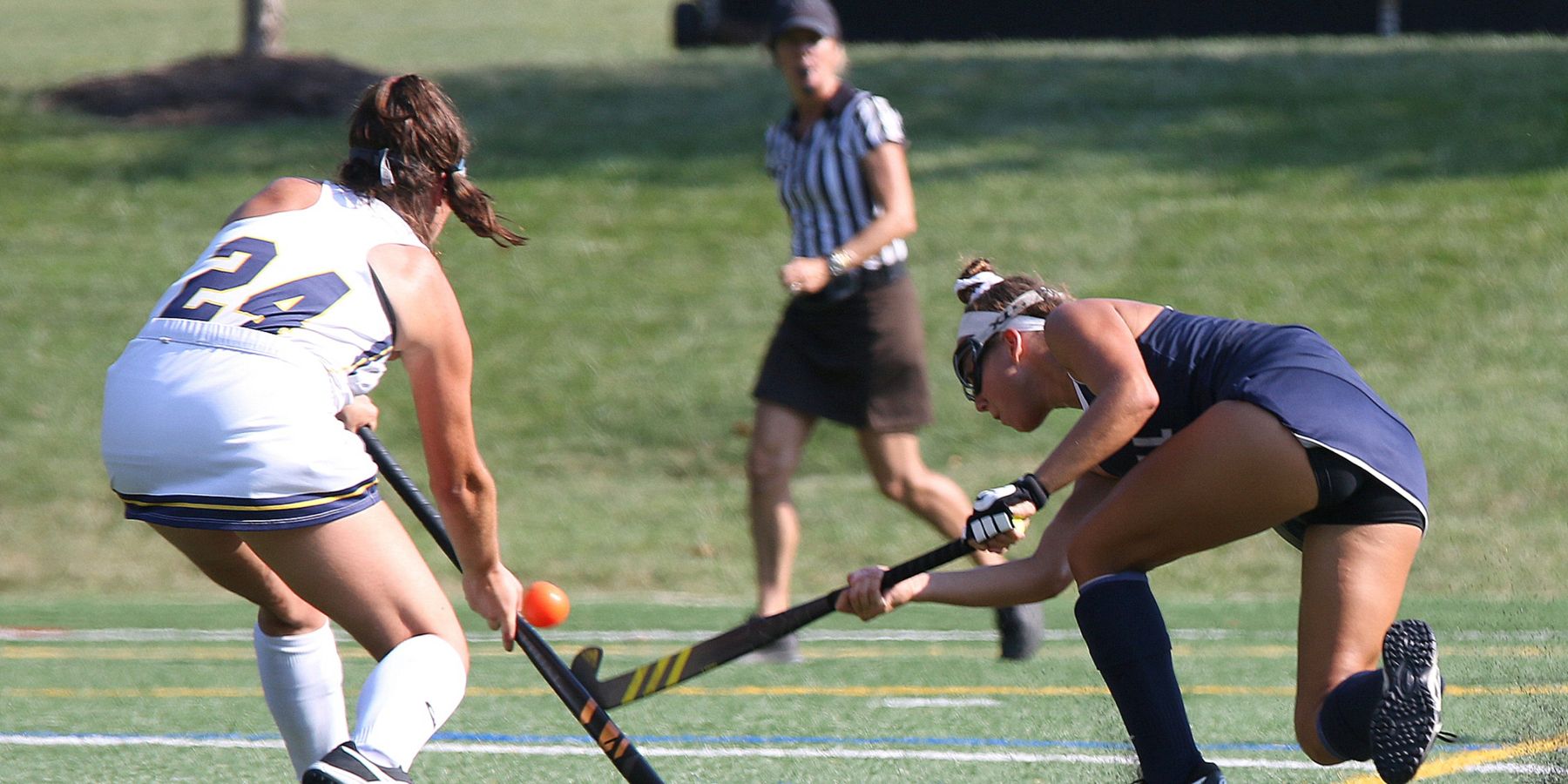 Women field hockey players compete fiercely on a sunny day in Rosemont, PA.