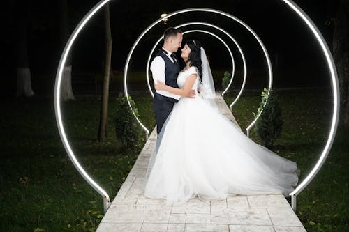 Lights over Smiling Newlyweds at Night