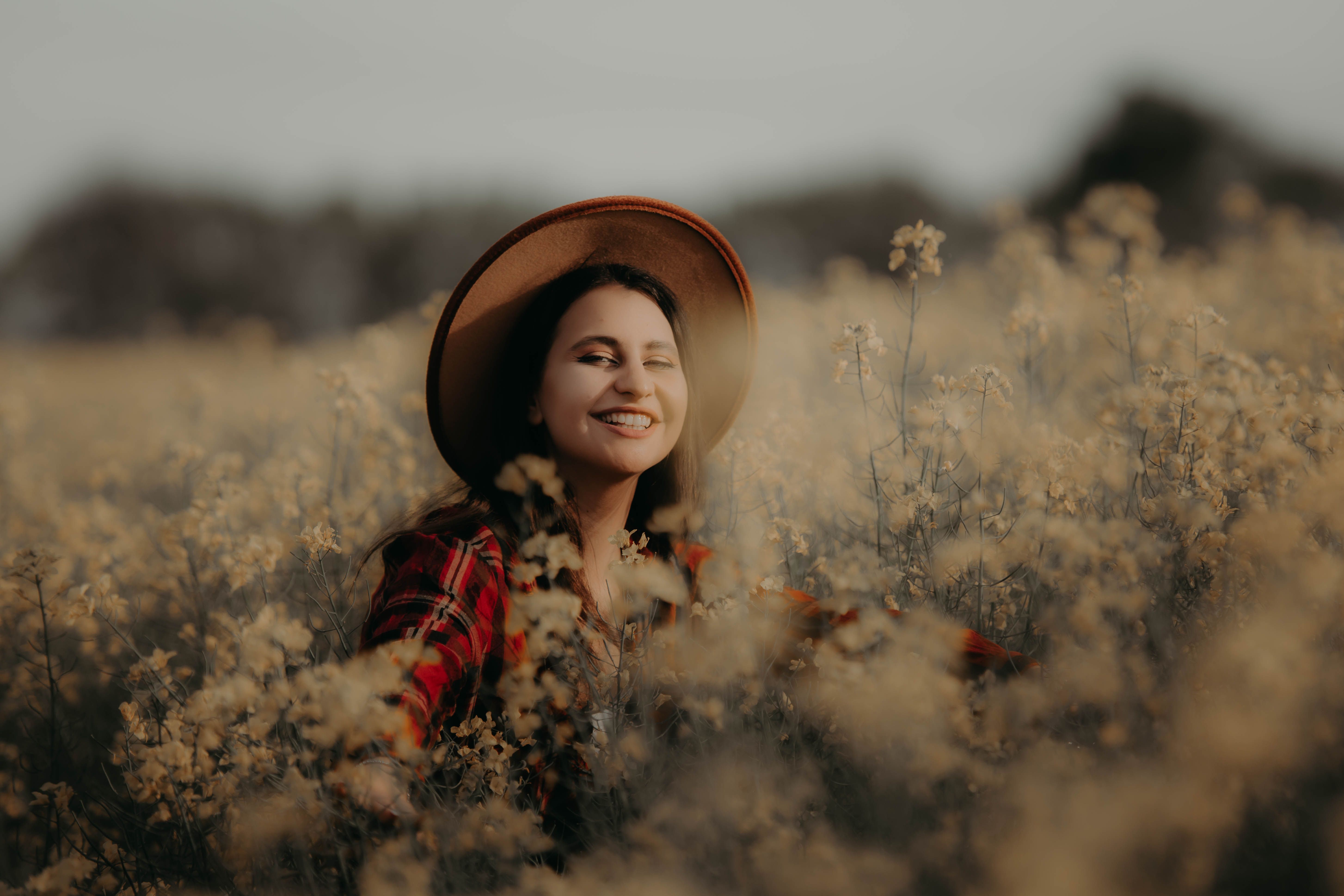 Smiling Woman in a Field · Free Stock Photo