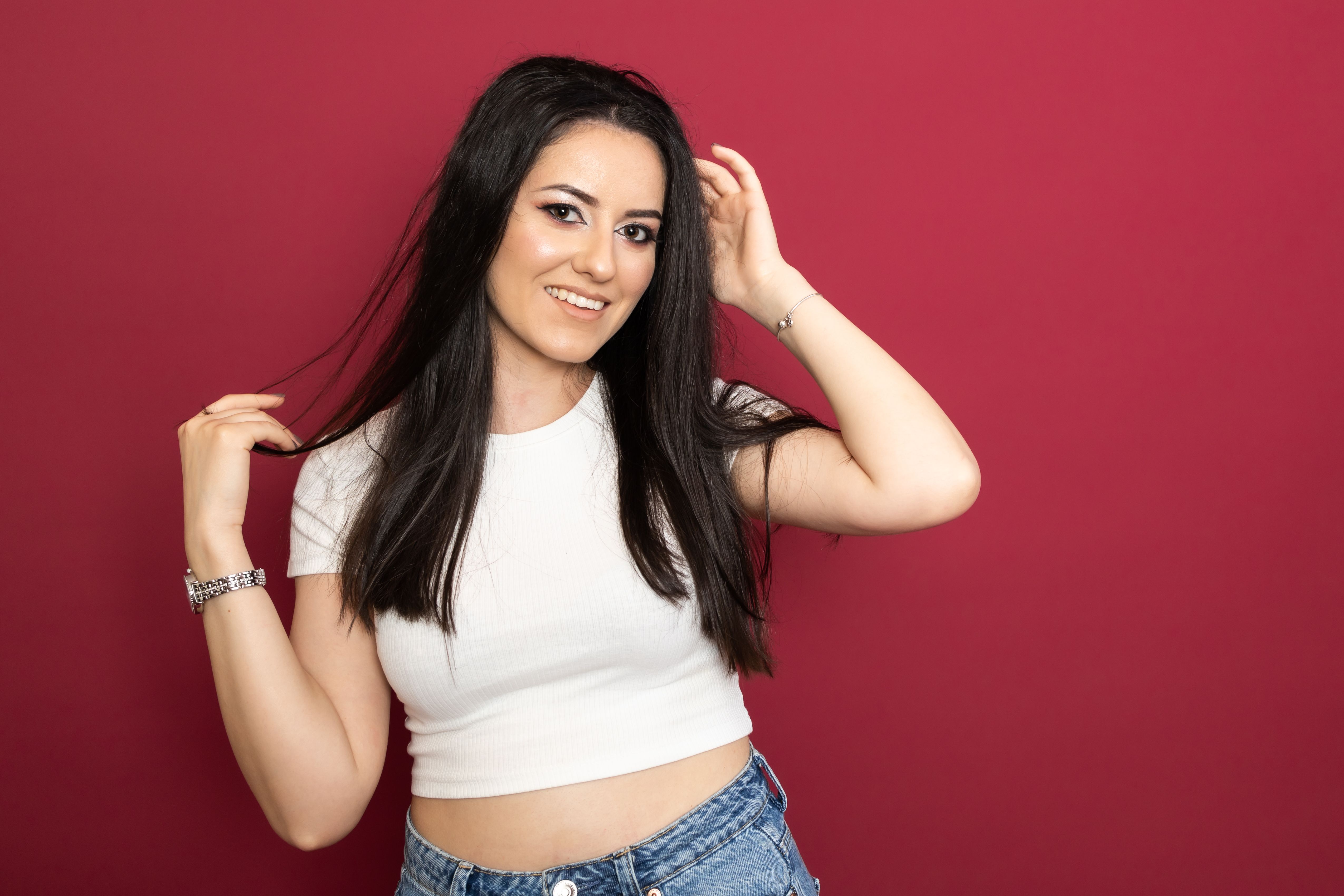 Portrait of a Smiling Woman with Black Hair · Free Stock Photo