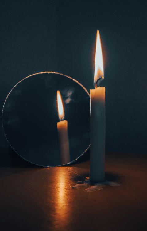 Lit Candle Reflecting in a Mirror · Free Stock Photo