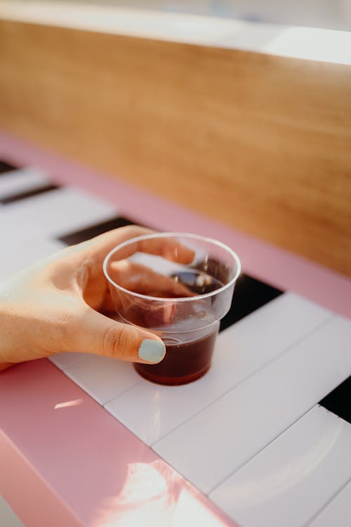 Free Hand Holding a Plastic Cup  Stock Photo