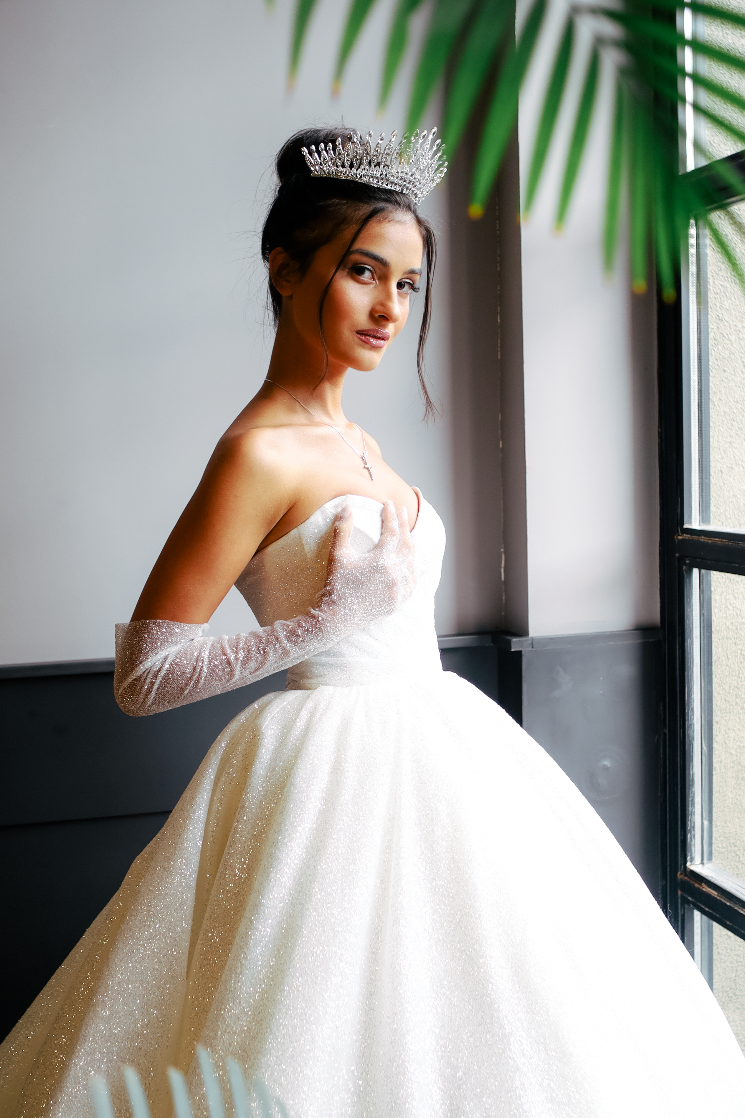 Cute Young Woman in a Wedding Dress Standing by the Window  Free Stock  Photo