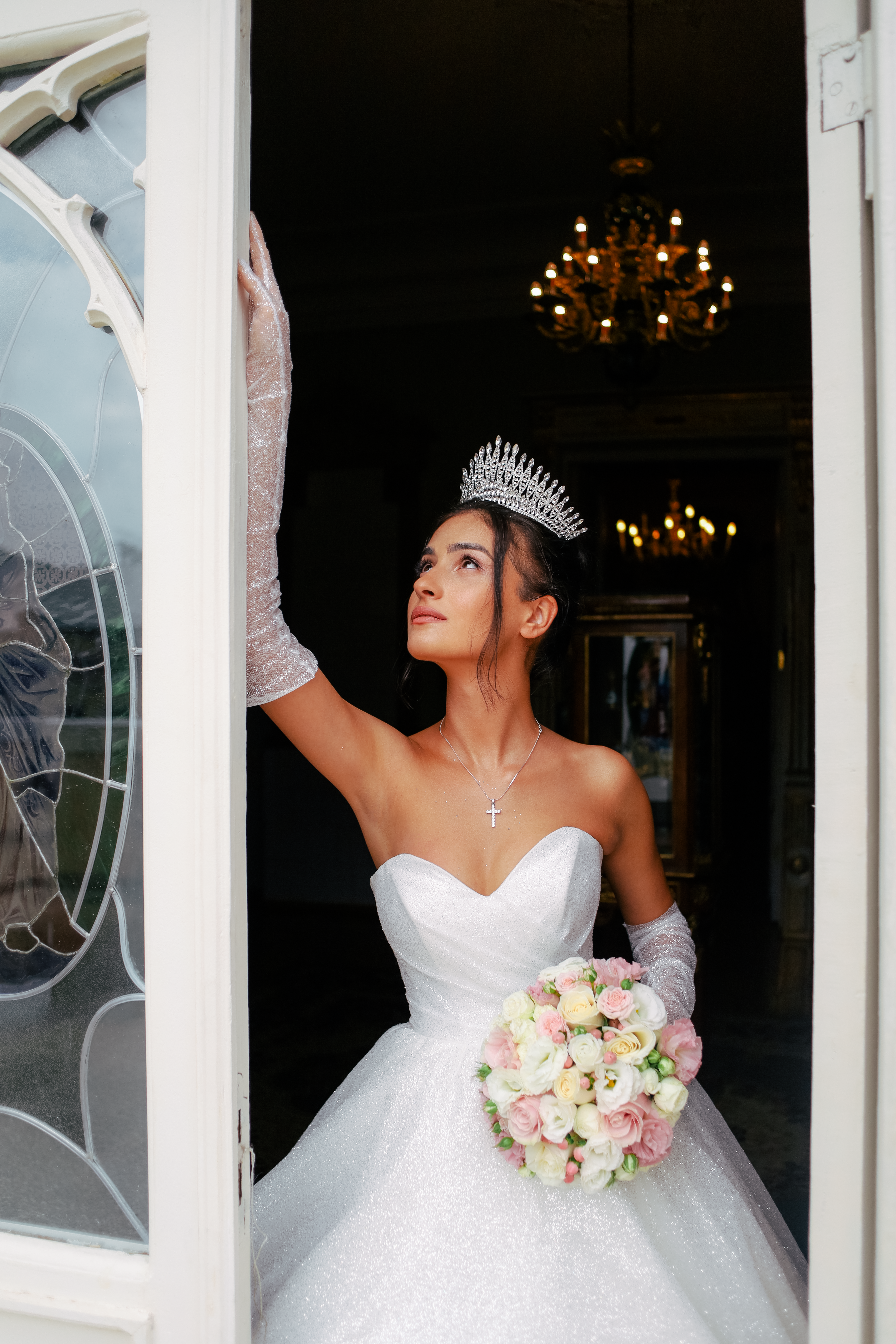 Bride in Elegant White Gown and Crystal Tiara Posing in a Doorway ...