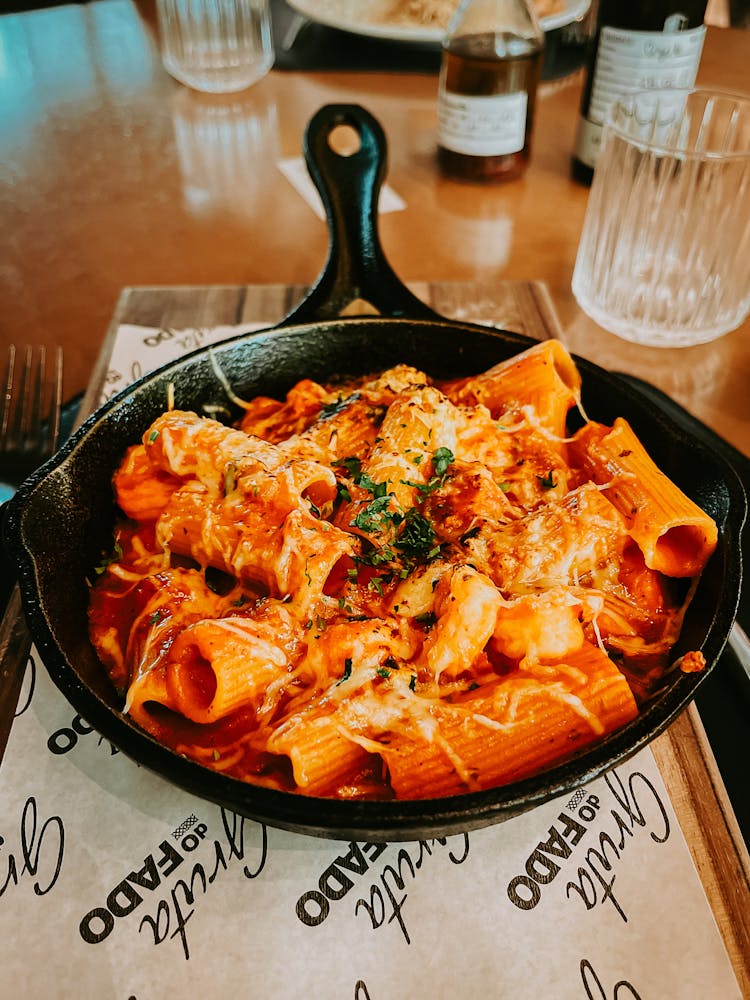 Pan With Rigatoni Pasta With Tomato Sauce Melted Cheese And Sprinkled With Basil