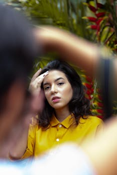 Captivating portrait of a woman during an outdoor fashion photoshoot, showcasing modern style.
