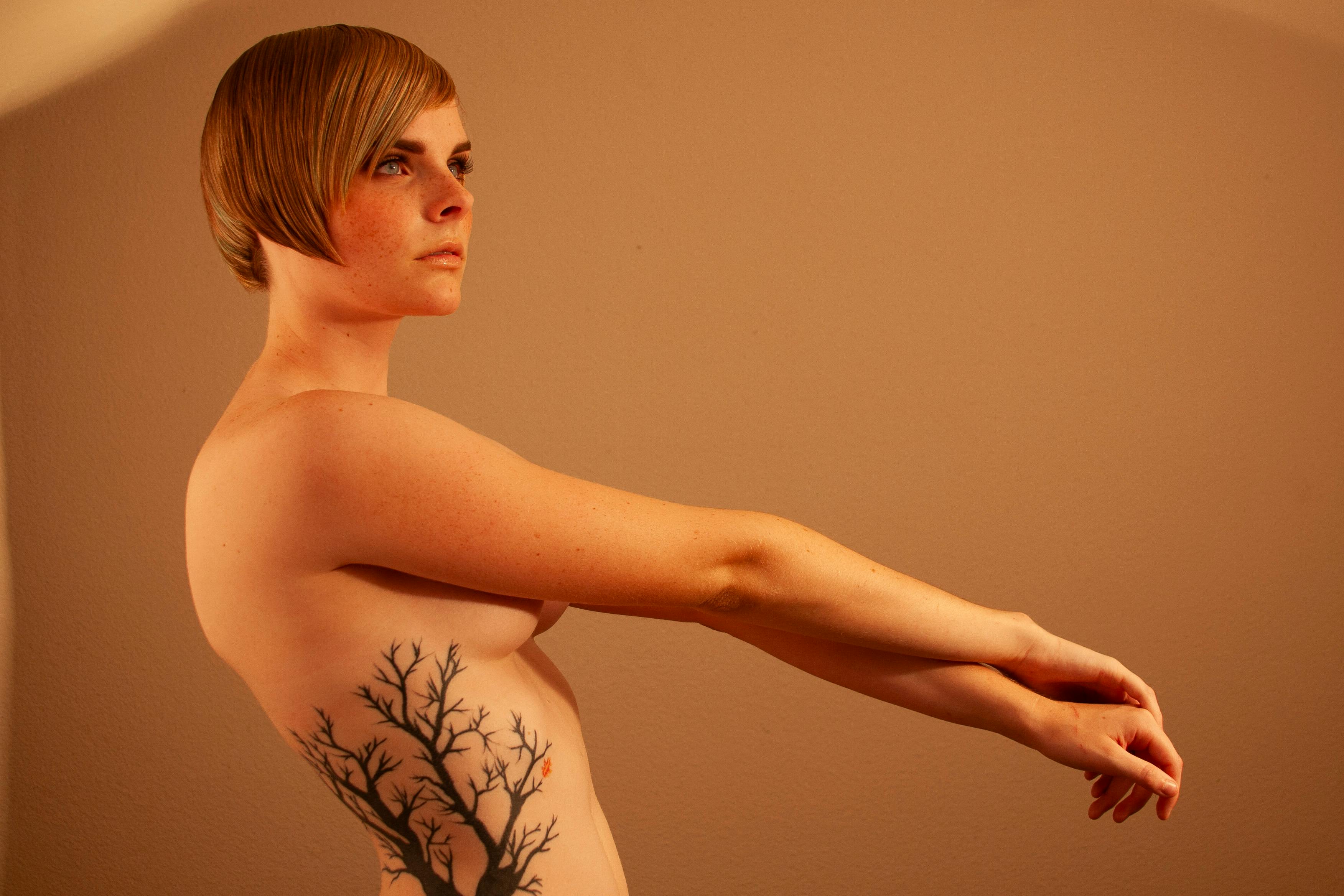 Studio Shot of a Topless Woman with a Tattoo · Free Stock Photo