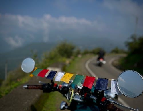 Colorful Cards on Motorbike Handlebar