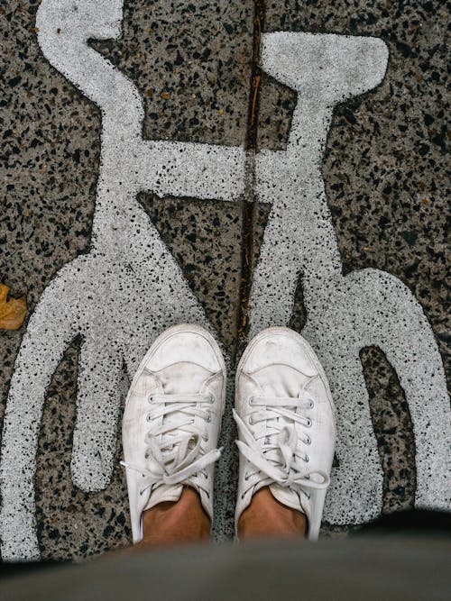 Free Person Wearing White Low-top Sneakers Stock Photo