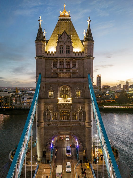 Illuminated Tower Bridge over Thames River in London, UK