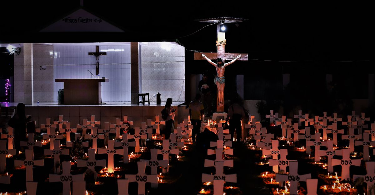 Christ Embassy Loveworld Arena night view with glowing cross