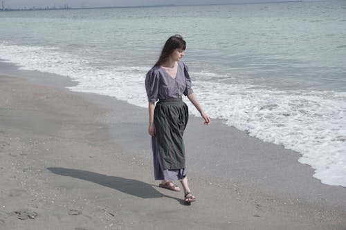 Woman on a Stroll along Sea
