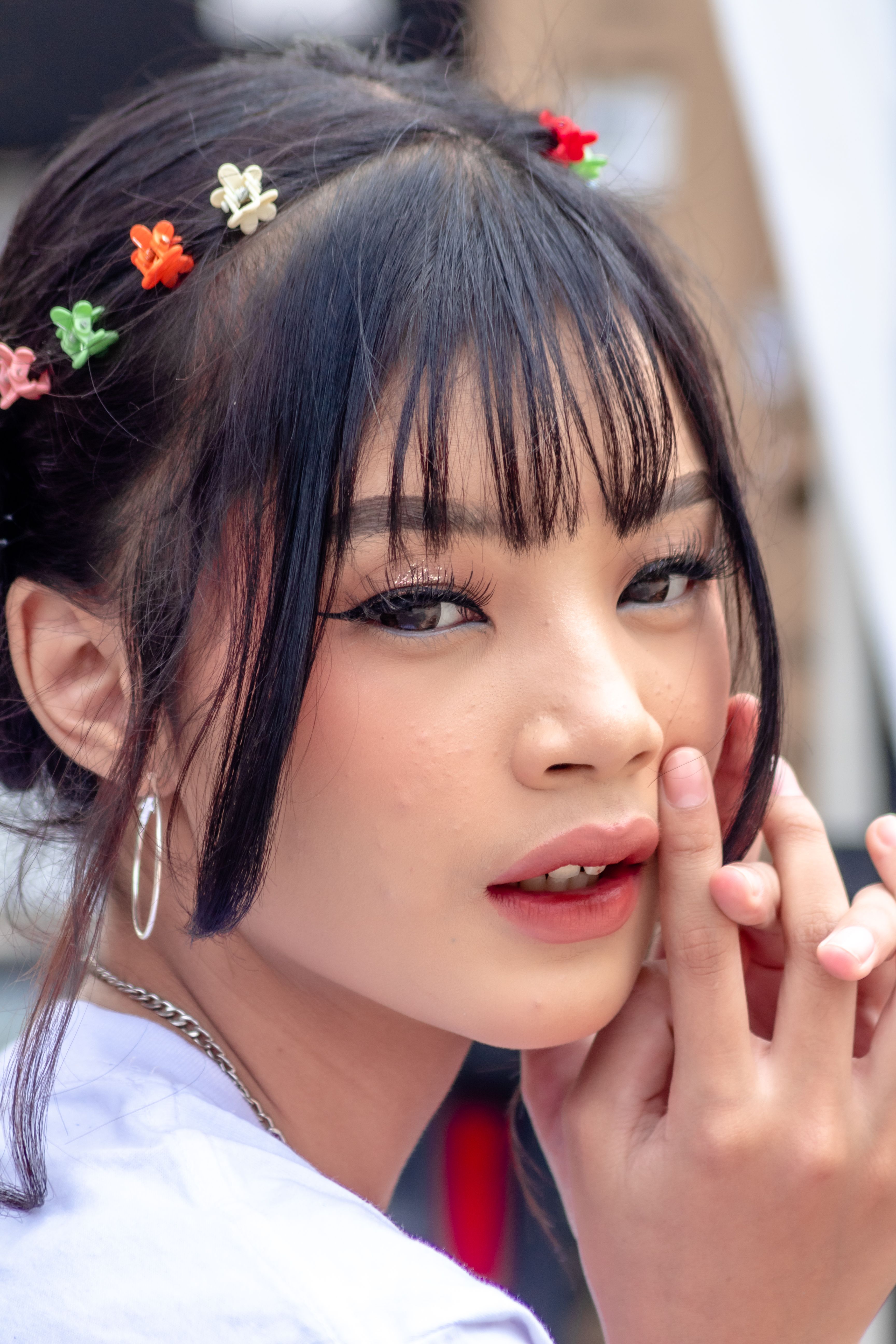 Young Woman with Colorful Clips in Her Hair · Free Stock Photo