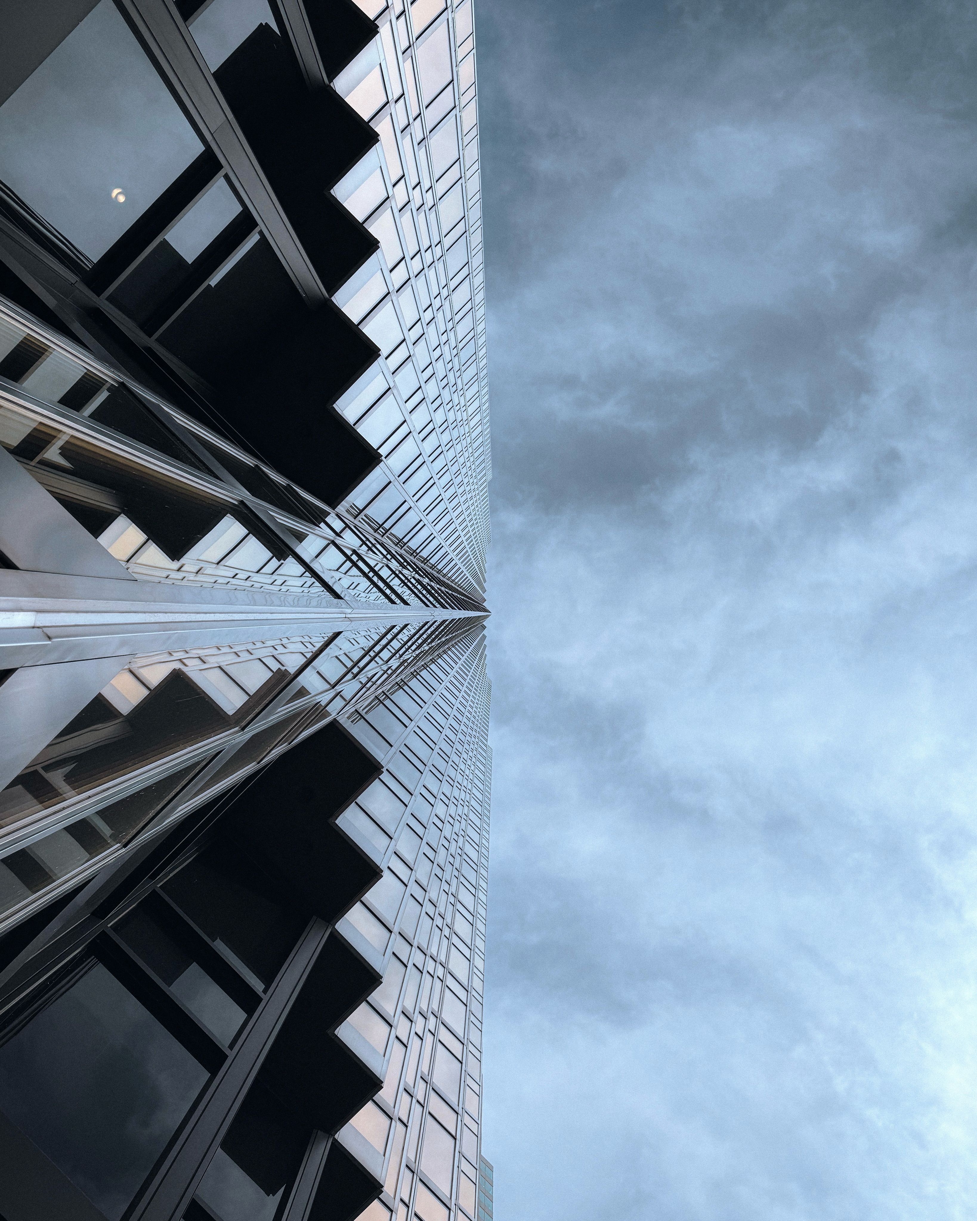 Low Angle Shot of a Modern Skyscraper in City · Free Stock Photo