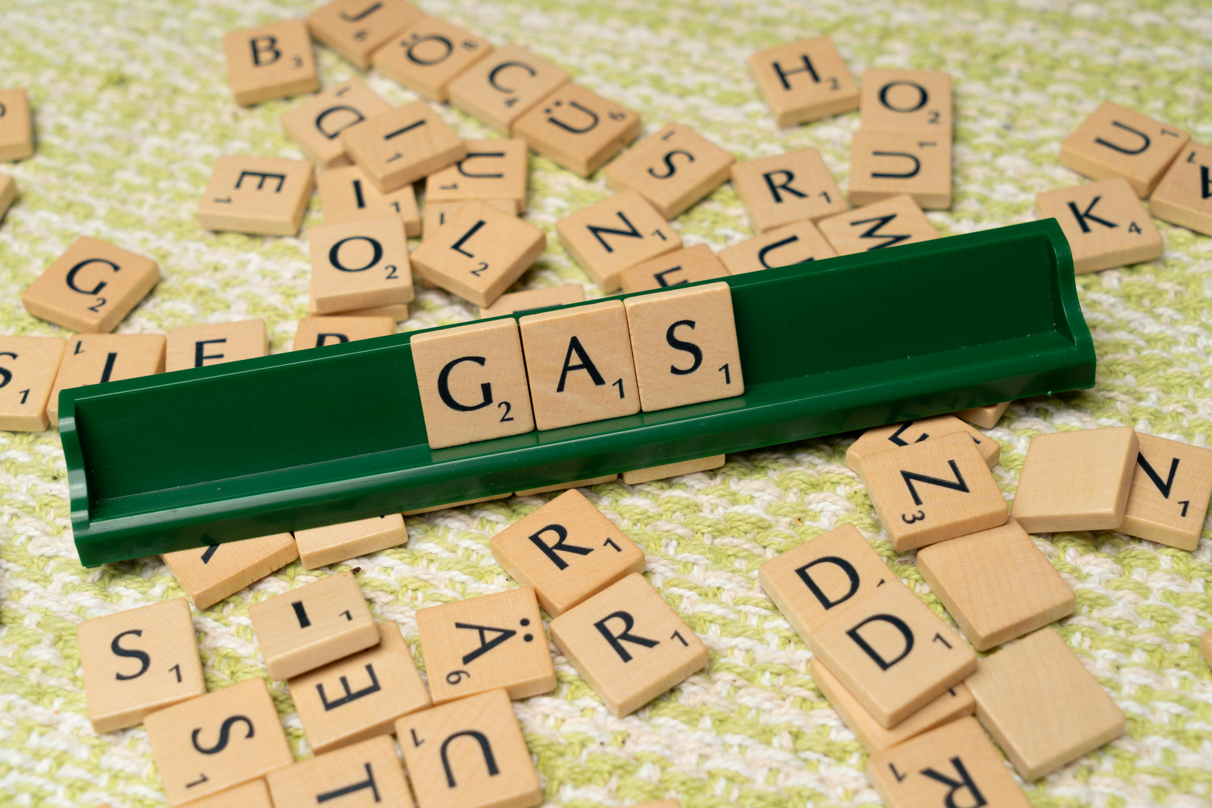 Gas is spelled out with scrabble tiles · Free Stock Photo