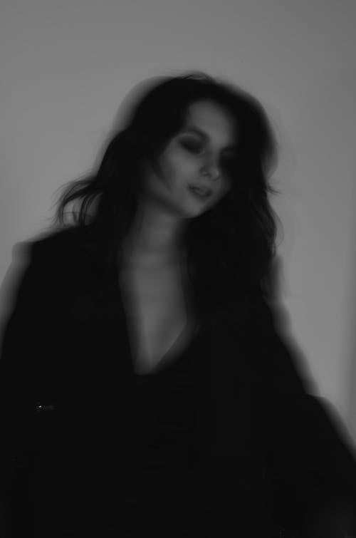 Blurry Black and White Photo of a Woman 