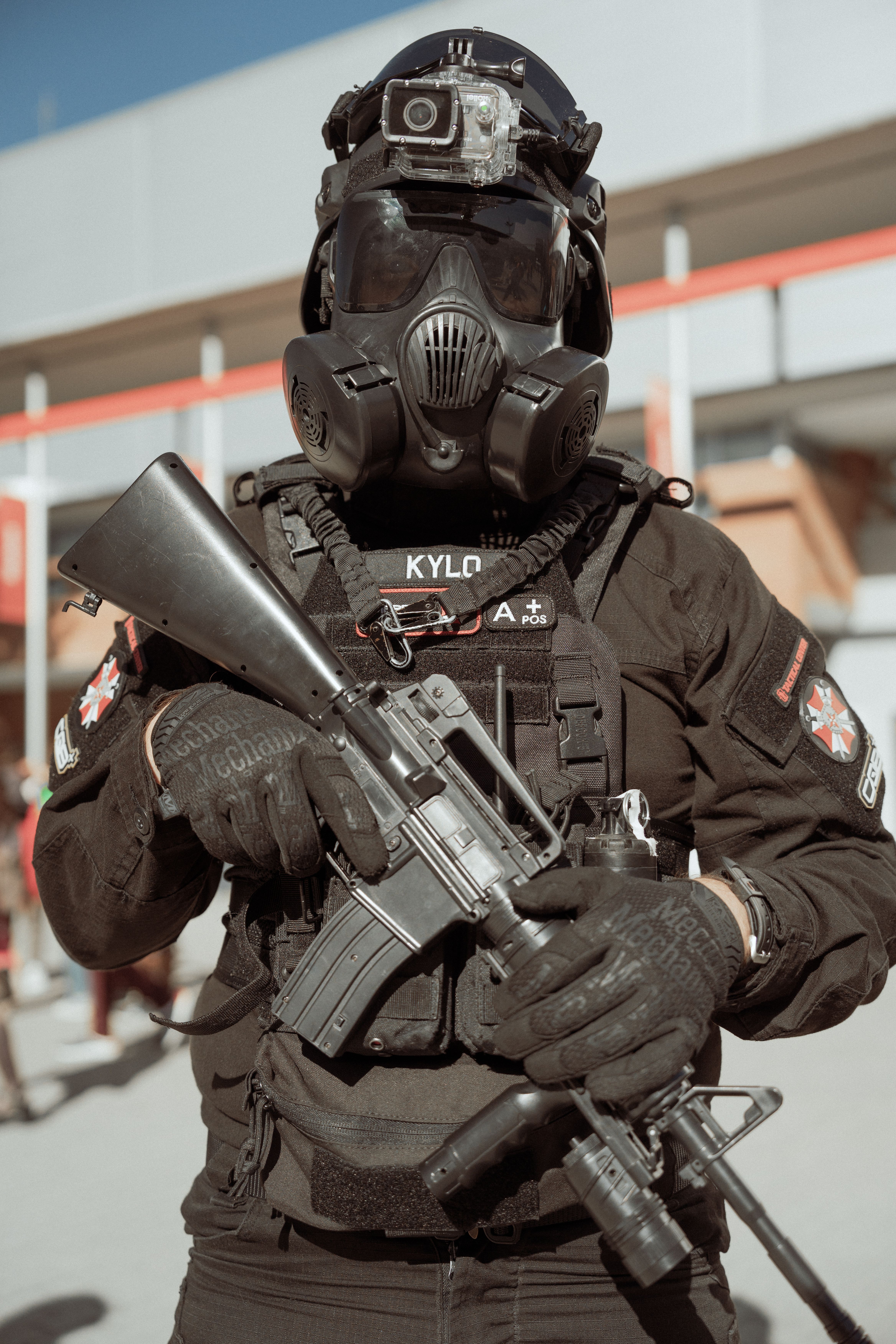 Rifle operator in gas mask