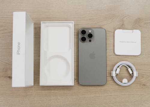 Free Unboxing iPhone 15 Pro Max box in Natural Titanium color - (Mention @zana_qaradaghy on Instagram while use this photo) Follow on Instagram @zana_qaradaghy Stock Photo