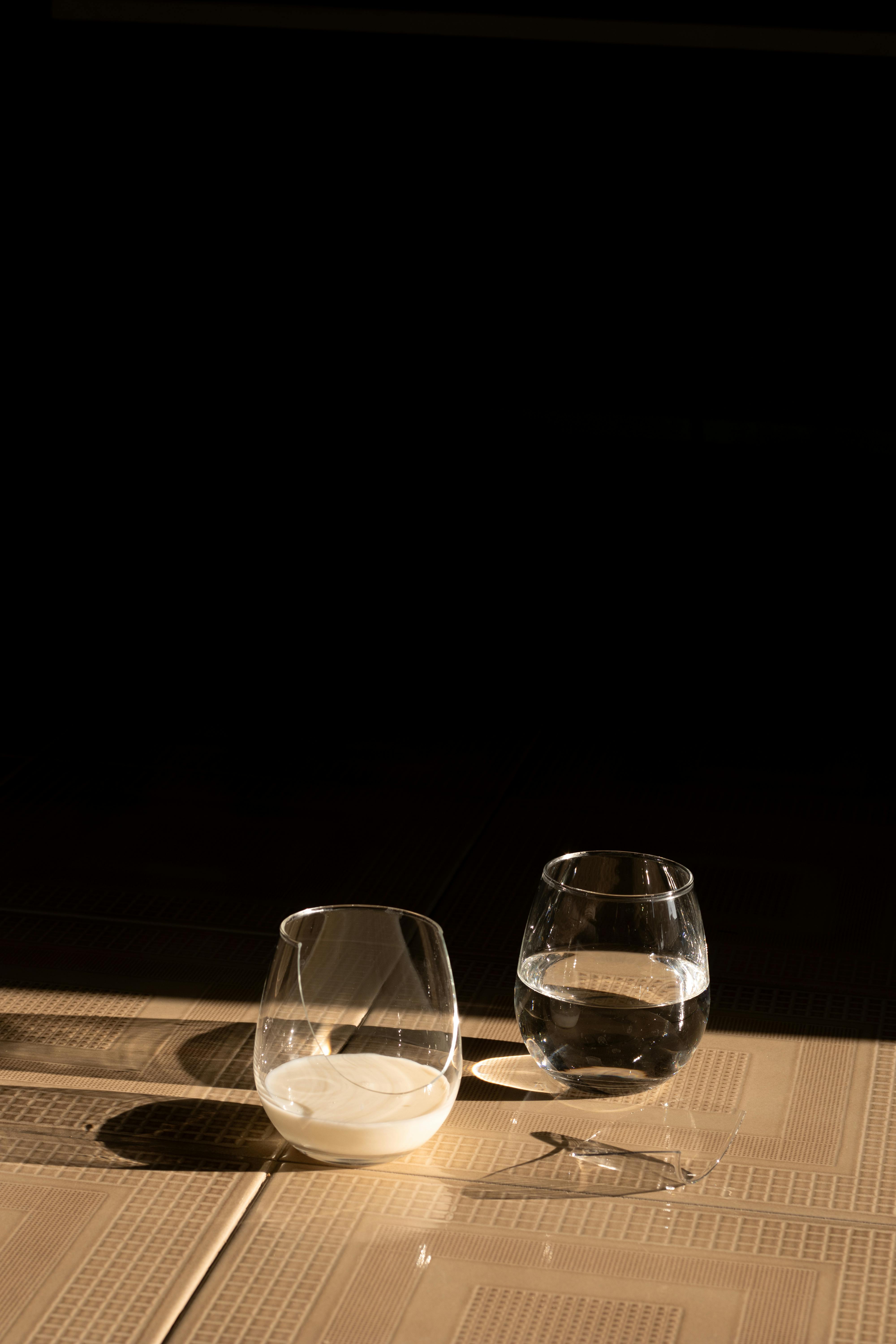 two glasses of water on a table