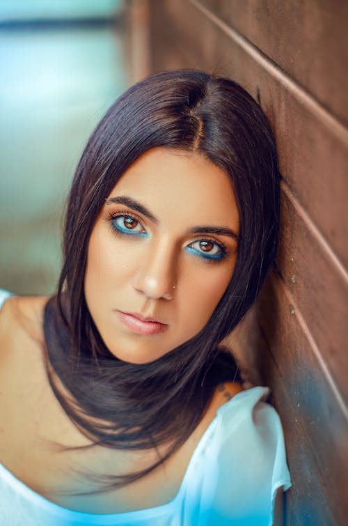 Brunette Woman with Blue Makeup